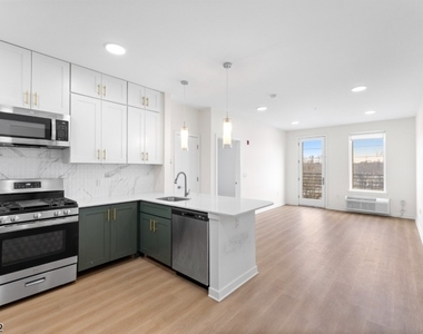 321 E 3rd St - Photo Thumbnail 8