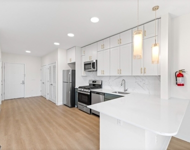 321 E 3rd St - Photo Thumbnail 19