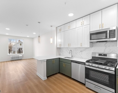 321 E 3rd St - Photo Thumbnail 10