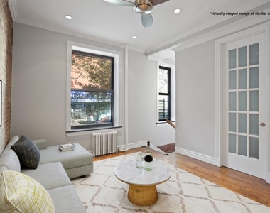 E 18th St - Photo Thumbnail 2