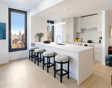 East 50 Street - Photo Thumbnail 2