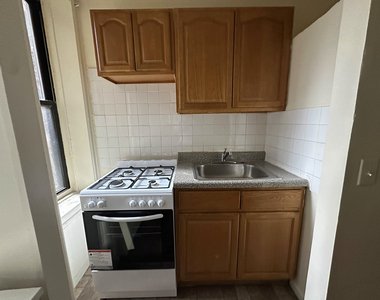 61-25 Woodside Avenue - Photo Thumbnail 1