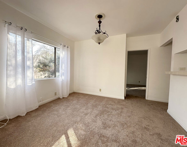 6069 1/2 Cashio Street - Photo Thumbnail 3