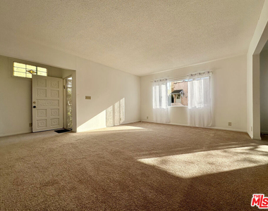 6069 1/2 Cashio Street - Photo Thumbnail 1