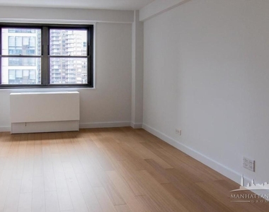E 39th St - Photo Thumbnail 6