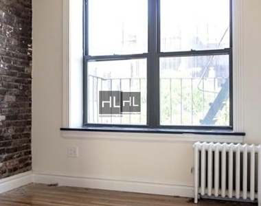 E 13th St. - Photo Thumbnail 2