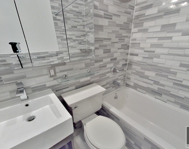 E 13th St. - Photo Thumbnail 4