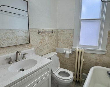 112 E 3rd Street - Photo Thumbnail 24