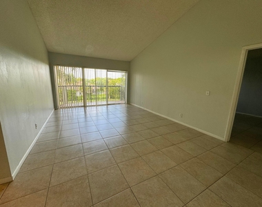 8891 Wiles Road - Photo Thumbnail 2