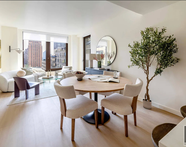 East 50 Street - Photo Thumbnail 2