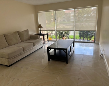 9033 Wiles Road - Photo Thumbnail 1