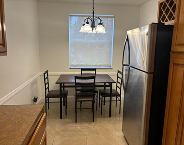 9033 Wiles Road - Photo Thumbnail 2