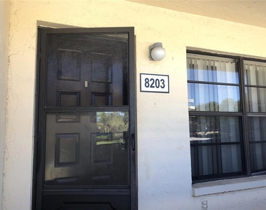 13608 S Village Drive - Photo Thumbnail 2