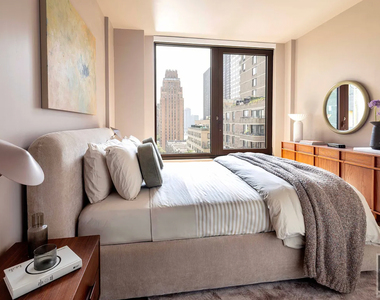 East 50 Street - Photo Thumbnail 2