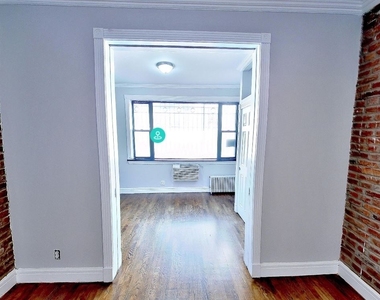E 13th St. - Photo Thumbnail 1