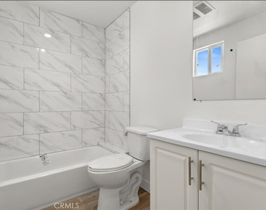 709 W 80th - Photo Thumbnail 3