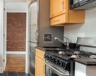 E 13th St. - Photo Thumbnail 2