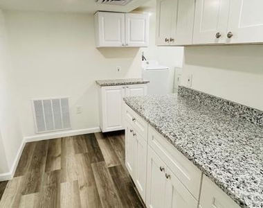 5015 Wilkens Ave - Photo Thumbnail 3