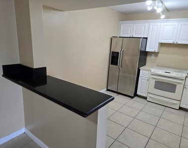 711 N Pine Island Road - Photo Thumbnail 4