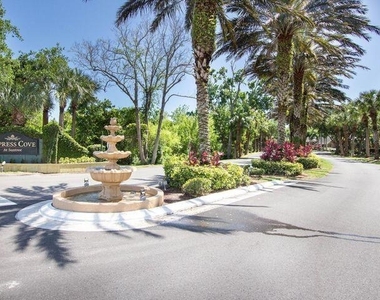 7667 N Wickham Road - Photo Thumbnail 1