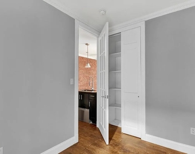 E 106th St - Photo Thumbnail 6