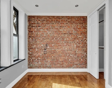 E 106th St - Photo Thumbnail 4