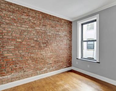 E 106th St - Photo Thumbnail 9