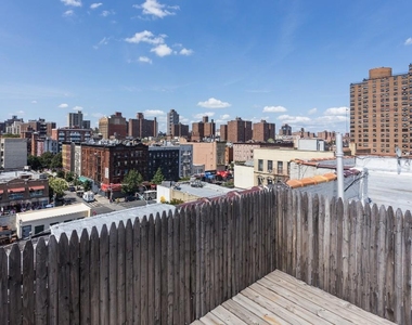 E 105th St - Photo Thumbnail 3