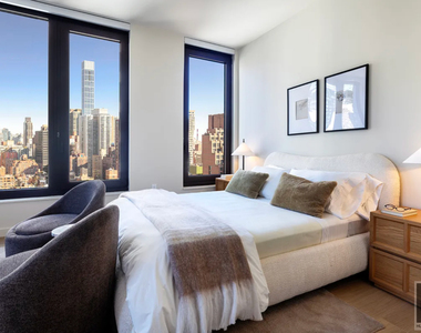 East 50 Street - Photo Thumbnail 3