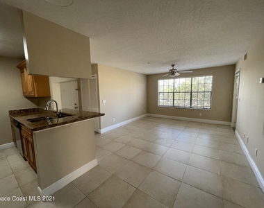 7667 N Wickham Road - Photo Thumbnail 2