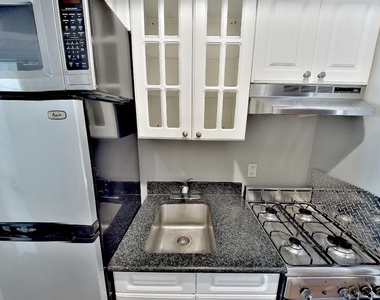 E 13th St. - Photo Thumbnail 3