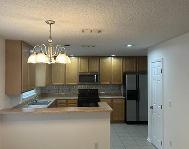 1603 Canopy Oaks Drive - Photo Thumbnail 1