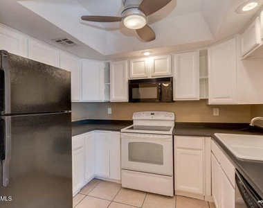 1402 S Jentilly Lane - Photo Thumbnail 5