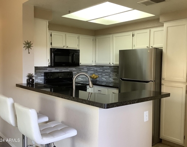 9450 E Becker Lane - Photo Thumbnail 4