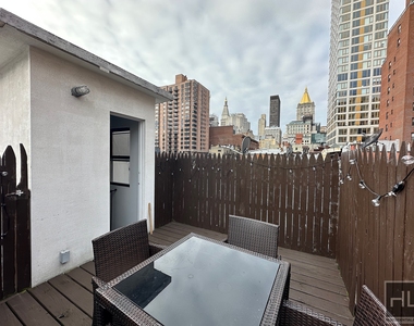 E 26th St. - Photo Thumbnail 5