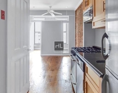 E 13th St. - Photo Thumbnail 5