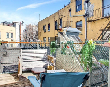 E 12th St. - Photo Thumbnail 2