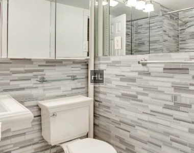 E 12th St. - Photo Thumbnail 4