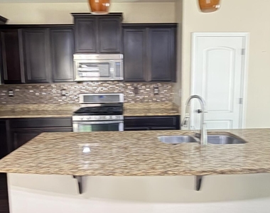 10786 W Yearling Road - Photo Thumbnail 3