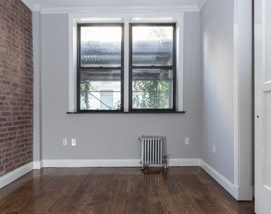 E 100th St - Photo Thumbnail 2
