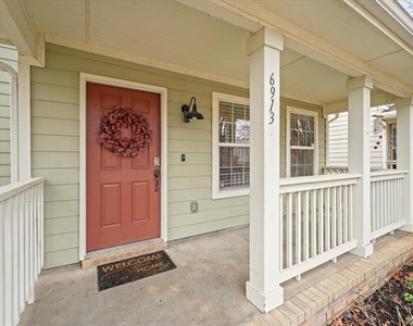 6913 Planters Row Drive - Photo Thumbnail 2