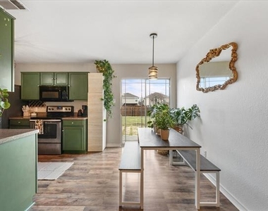 6913 Planters Row Drive - Photo Thumbnail 6
