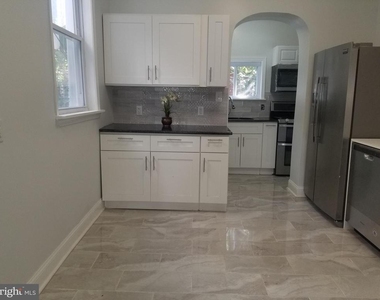 5538 Delancey Street - Photo Thumbnail 2