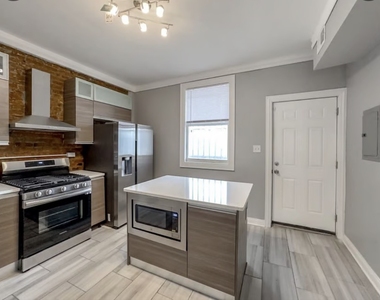 6500 S Rhodes Avenue - Photo Thumbnail 1