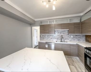 6500 S Rhodes Avenue - Photo Thumbnail 2