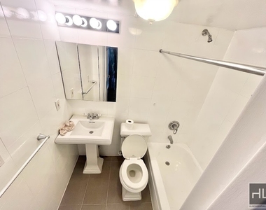 E 13th St. - Photo Thumbnail 4