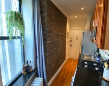 E 13th St. - Photo Thumbnail 4