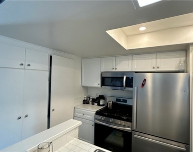 7025 Glade Ave - Photo Thumbnail 2