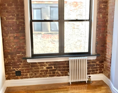 E 13th St. - Photo Thumbnail 5