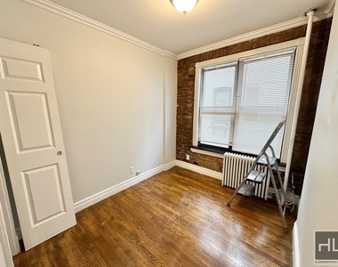 E 13th St. - Photo Thumbnail 4